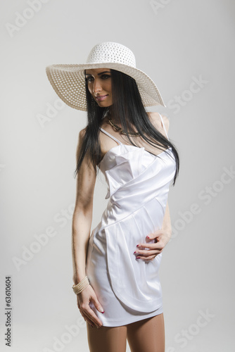 Photo: Pretty Caucasian woman in white dress Pretty Caucasian woman in white dress