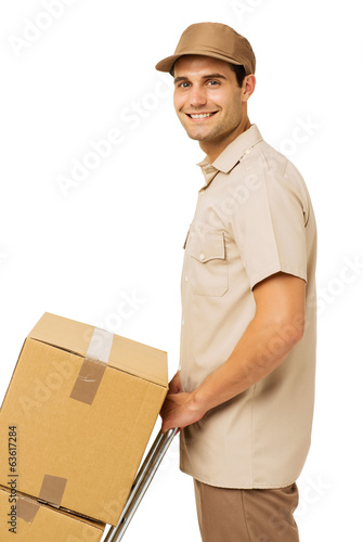 Photo: Smiling Young Deliveryman With Cardboard Boxes Smiling Young Deliveryman With Cardboard Boxes