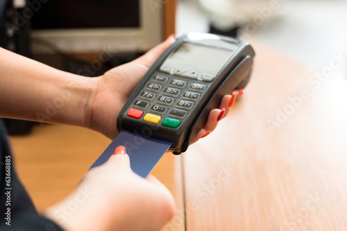 Photo: Woman pay by credit card Woman pay by credit card