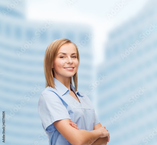 Photo: smiling female doctor or nurse smiling female doctor or nurse