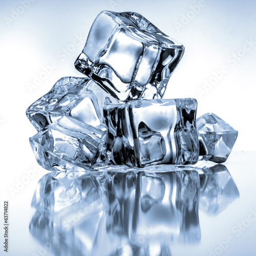 Photo: Ice cubes on blue background Ice cubes on blue background