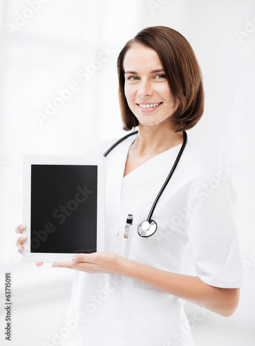 Photo: female doctor with tablet pc female doctor with tablet pc