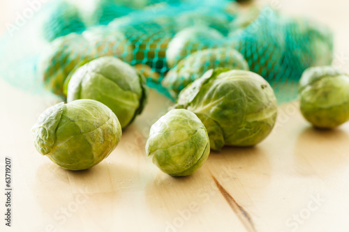 Photo: Brussels sprouts cabbage on old wooden table Brussels sprouts cabbage on old wooden table