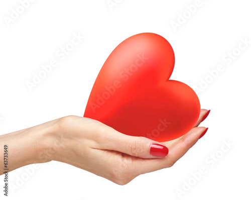 Photo: Red heart in woman hands isolated on white background Red heart in woman hands isolated on white background