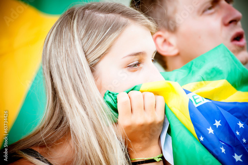 Photo: sad brazilian supporters at stadium sad brazilian supporters at stadium
