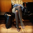Elegant Lady waiting in the boarding area of an airport Elegant Lady waiting in the boarding area of an airport