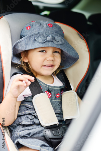 Photo: happy toddler in the car happy toddler in the car