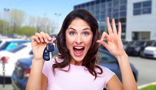 Photo: Beautiful woman with a car key. Beautiful woman with a car key.