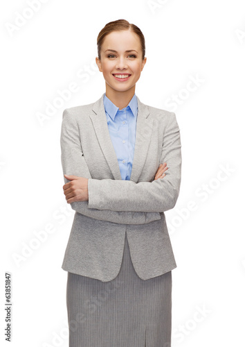 Photo: young smiling businesswoman with crossed arms young smiling businesswoman with crossed arms