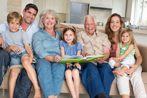 Photo: Family with storybook at home Family with storybook at home