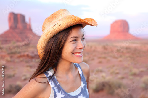 Photo: Cowgirl woman happy portrait in Monument Valley Cowgirl woman happy portrait in Monument Valley