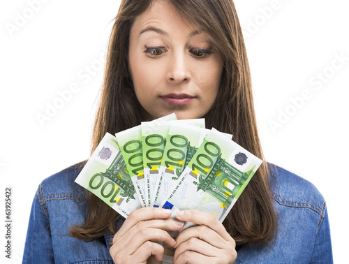 Photo: Beauitful woman holding some Euro currency notes Beauitful woman holding some Euro currency notes