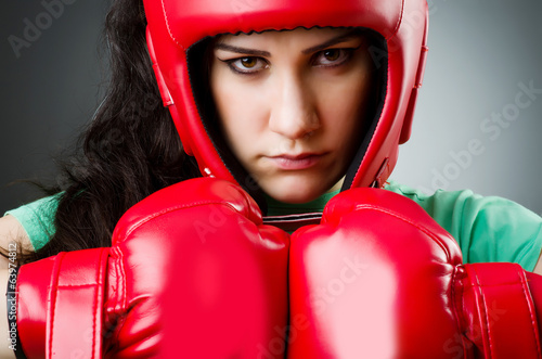 Photo: Woman boxer on white background Woman boxer on white background