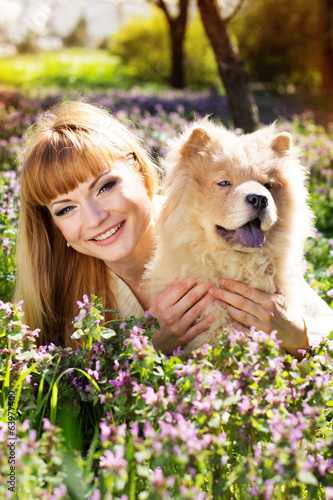 Photo: Portrait of a woman with her dog outdoors Portrait of a woman with her dog outdoors