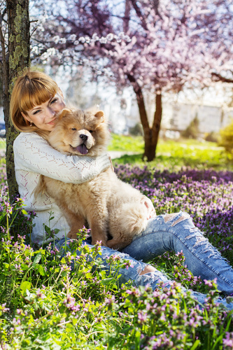 Photo: Portrait of a woman with her dog outdoors Portrait of a woman with her dog outdoors
