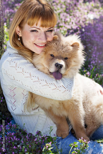 Photo: Portrait of a woman with her dog outdoors Portrait of a woman with her dog outdoors
