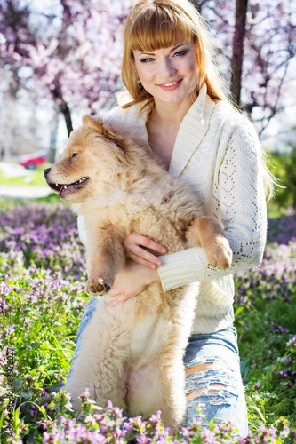 Photo: Portrait of a woman with her dog outdoors Portrait of a woman with her dog outdoors