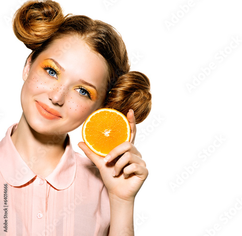 Photo: Beauty Model Girl with Juicy Orange. Joyful Teen Girl Beauty Model Girl with Juicy Orange. Joyful Teen Girl