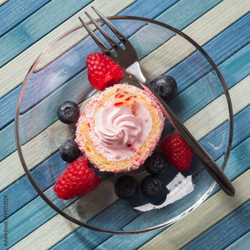 Photo: Top view of the cake with blueberries and raspberries Top view of the cake with blueberries and raspberries