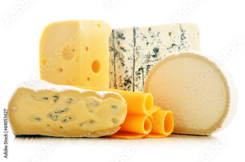 Photo: Different sorts of cheese isolated on white background Different sorts of cheese isolated on white background
