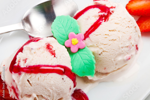 Photo: Strawberry ice cream with fruits close up Strawberry ice cream with fruits close up