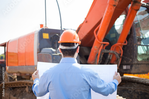 Photo: Man at work in a construction site Man at work in a construction site