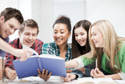 Photo: students reading book at school students reading book at school