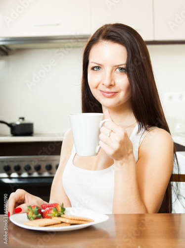 Photo: woman having breakfast woman having breakfast