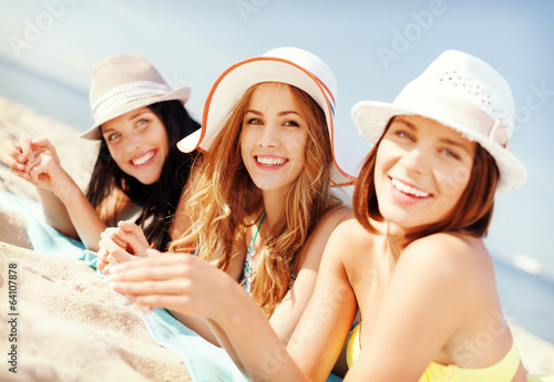 Photo: girls sunbathing on the beach girls sunbathing on the beach