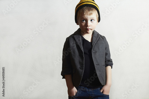 Photo: Funny little Boy.grunge cap and jeans.Fashion Children Funny little Boy.grunge cap and jeans.Fashion Children