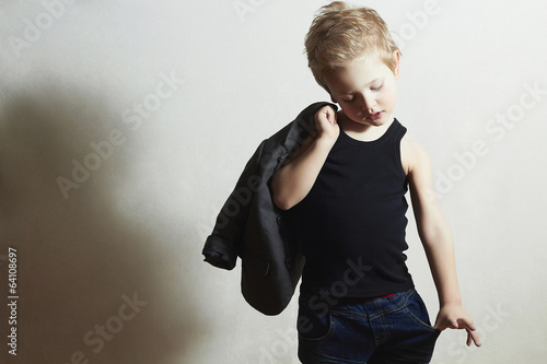 Photo: fashionable little boy.stylish haircut. fashion children fashionable little boy.stylish haircut. fashion children