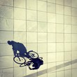Cycling man and his shadow in Berlin Cycling man and his shadow in Berlin