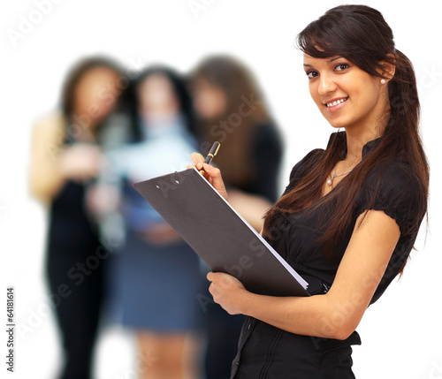 Photo: Charming girl holding a folder and looking at camera Charming girl holding a folder and looking at camera