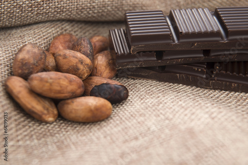 Photo: Cocoa (cacao) beans with chocolate Cocoa (cacao) beans with chocolate