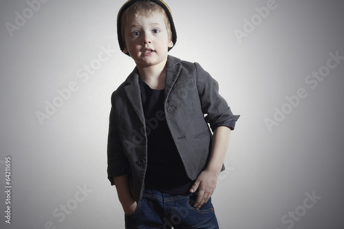 Photo: Funny little Boy.grunge cap and jeans.Fashion Children Funny little Boy.grunge cap and jeans.Fashion Children