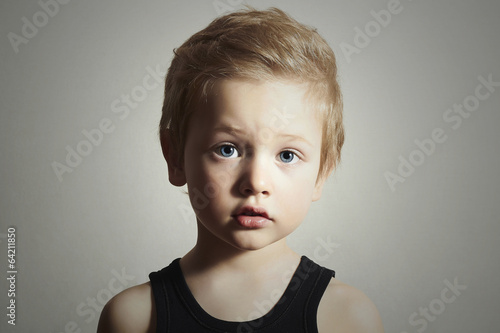 Photo: Child. Funny Little Boy. Handsome Kid with Blue Eyes.Children Child. Funny Little Boy. Handsome Kid with Blue Eyes.Children