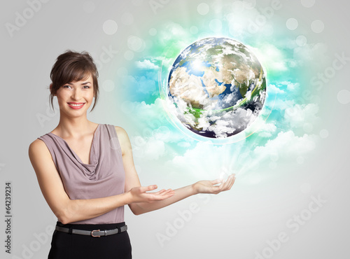 Photo: Young woman with earth and cloud concept Young woman with earth and cloud concept