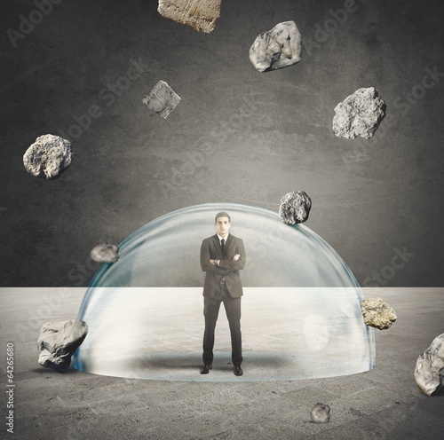 Photo: Businessman protected from the crisis Businessman protected from the crisis