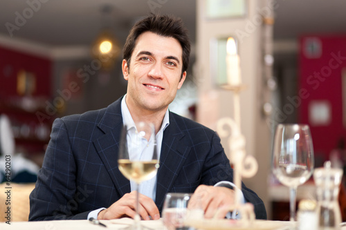 Photo: Man having dinner in a restaurant Man having dinner in a restaurant