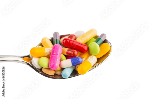 Photo: Viele Tabletten auf Löffel Viele Tabletten auf Löffel