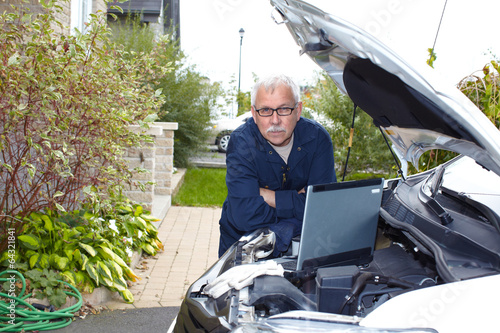 Photo: Car mechanic. Car mechanic.