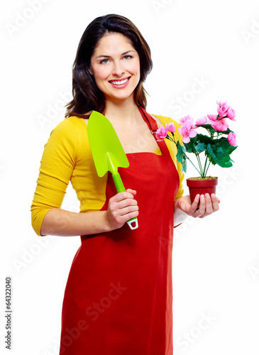 Photo: Gardening woman with plant. Gardening woman with plant.