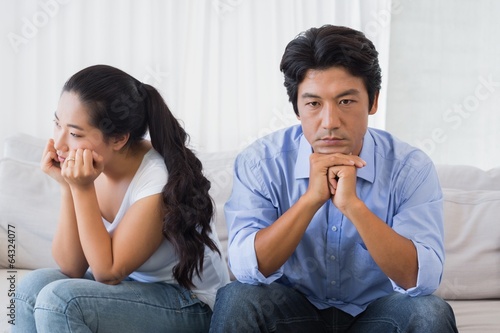 Photo: Couple not talking after a dispute on the sofa Couple not talking after a dispute on the sofa