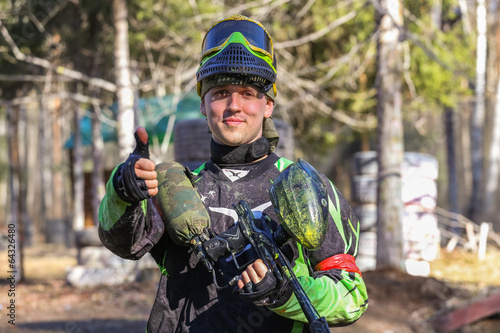 Photo: Smiling sportsman shows his thumb Smiling sportsman shows his thumb