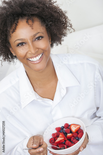 Photo: Mixed Race African American Woman Eating Fruit Mixed Race African American Woman Eating Fruit