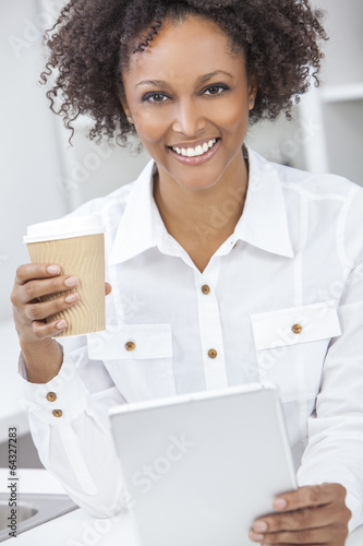 Photo: Mixed Race African American Girl Using Tablet Computer Mixed Race African American Girl Using Tablet Computer