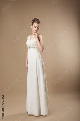 Photo: Gorgeous Shapely Woman in Long Smooth White Dress Gorgeous Shapely Woman in Long Smooth White Dress