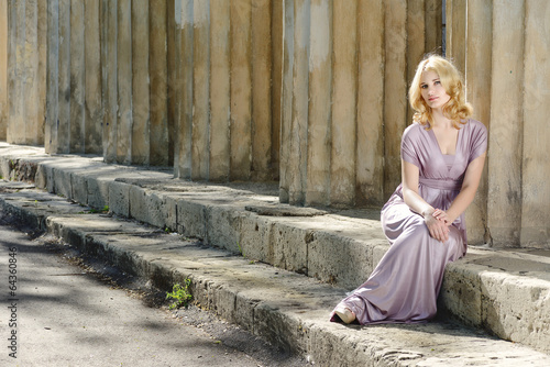 Photo: young model near old columns young model near old columns