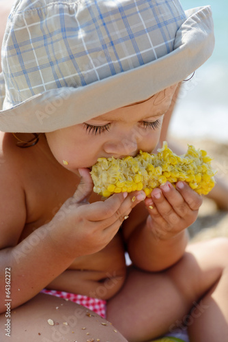 Photo: toddler eating corn toddler eating corn
