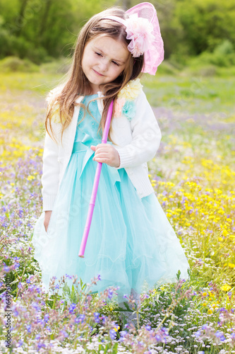 Photo: Little girl on the nature with butterfly net Little girl on the nature with butterfly net
